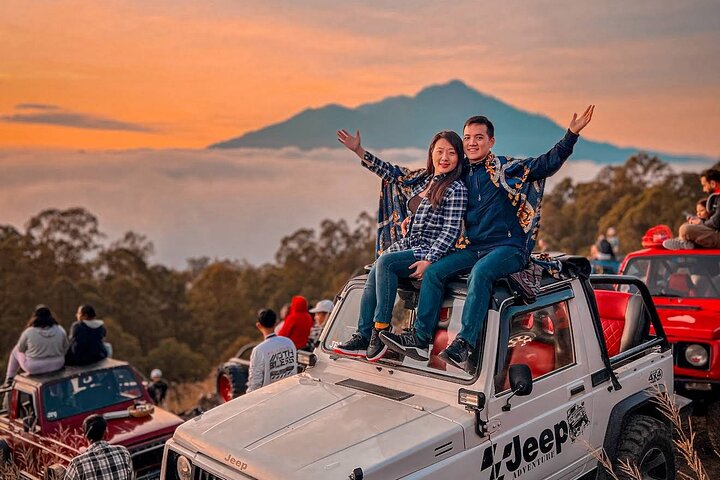 Convoy of 4x4 jeeps on Mount Batur volcanic slope