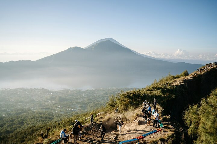 Travellers watching sunrise from Mount Batur viewpoint