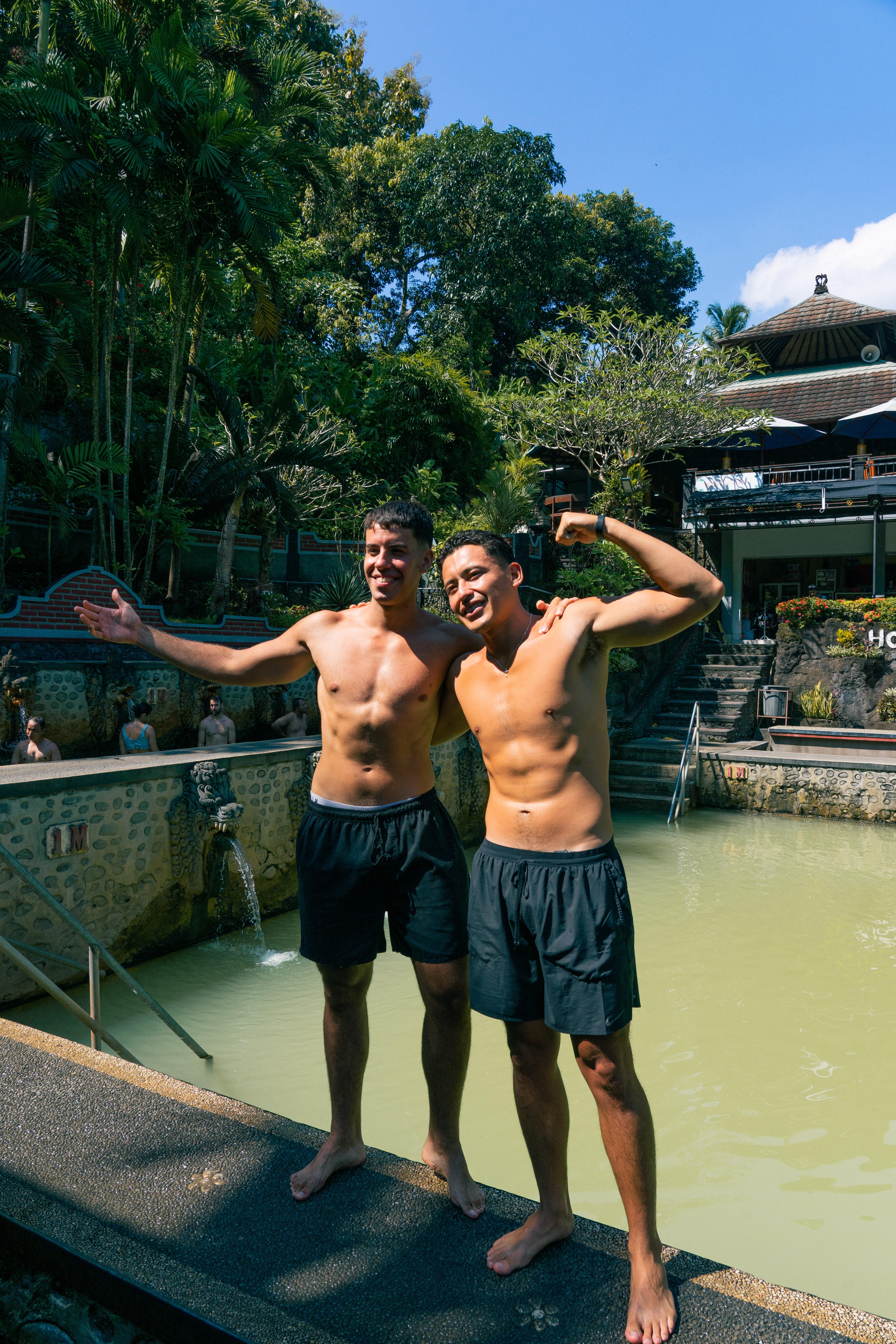 Two friends posing at Banjar hot springs warm pool